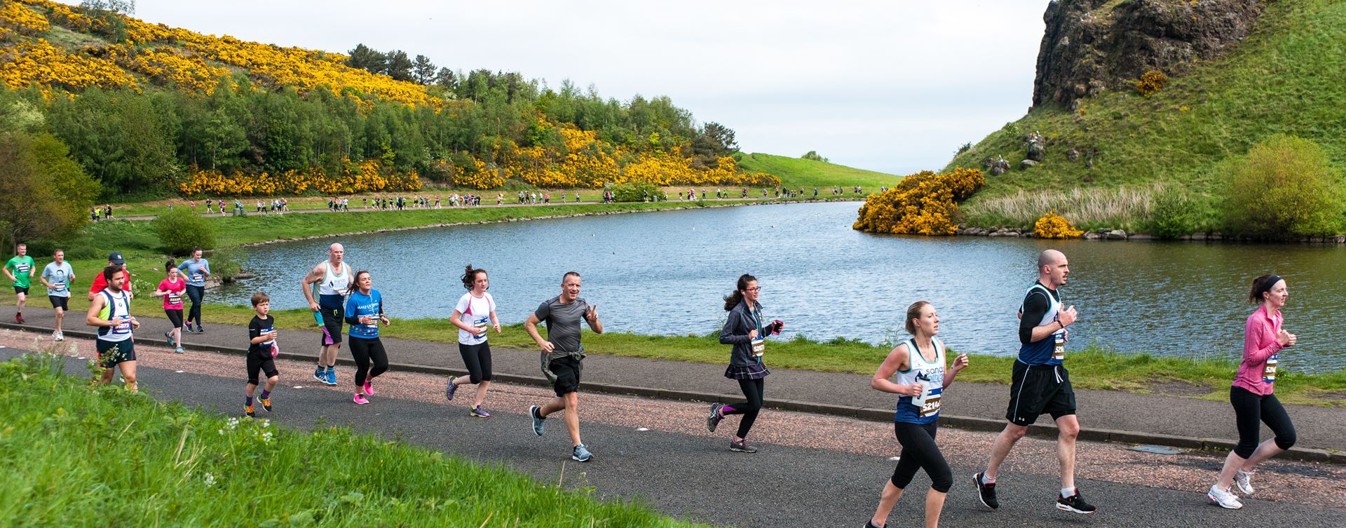 A photo of Edinburgh Marathon runners at Arthurs Seat pond