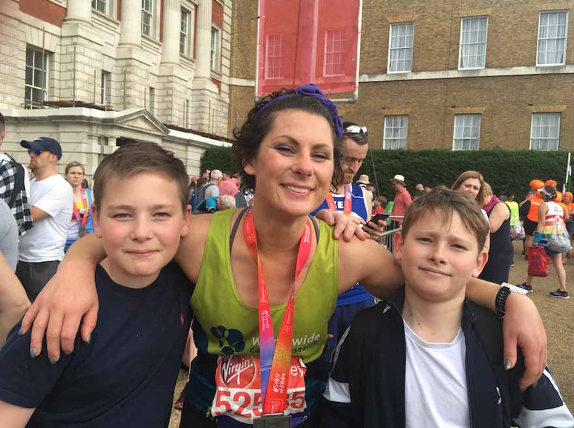 A photo of Elinor and her two sons after she finished her race 