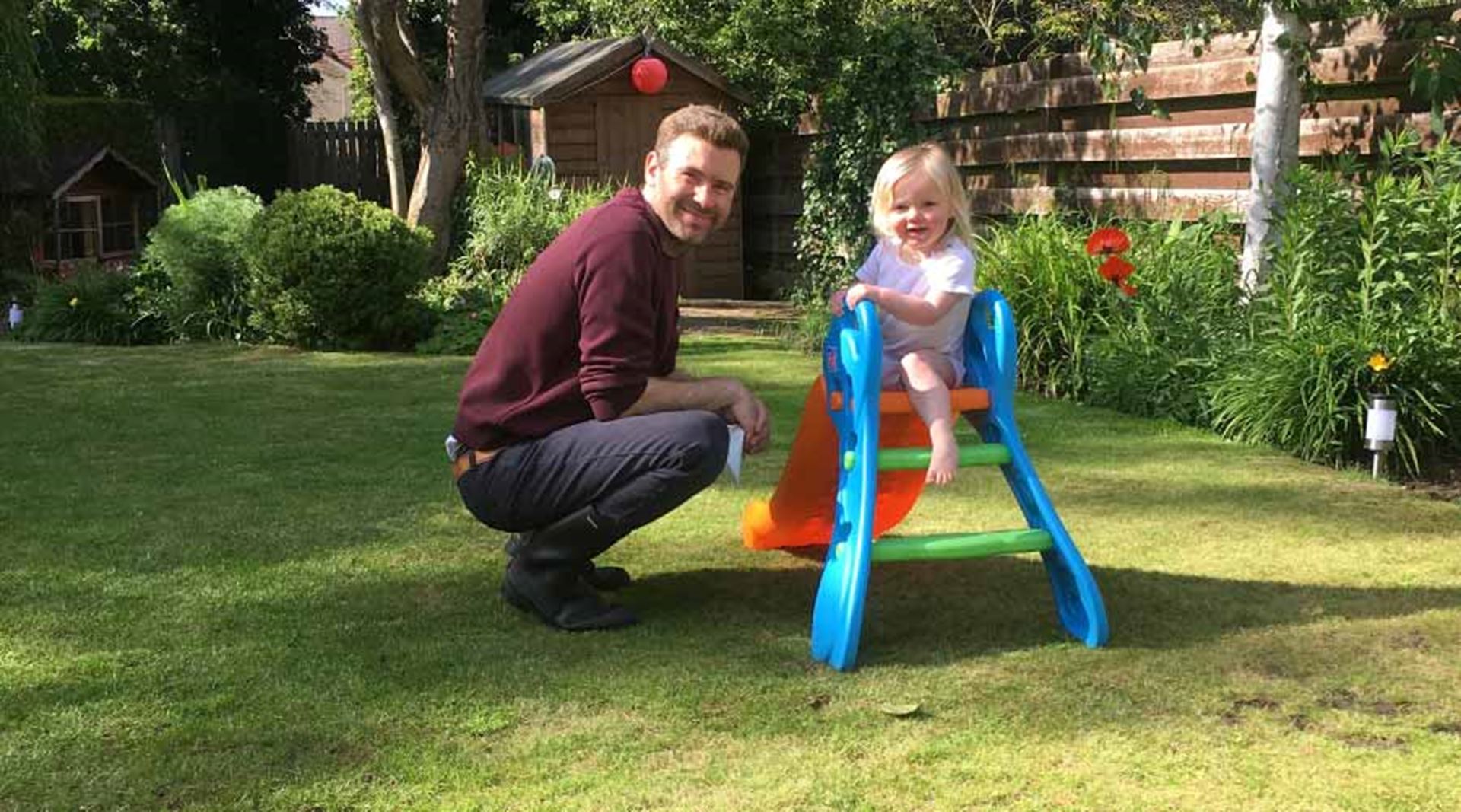 Adam and his daughter Skye playing in the garden
