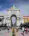 Lizbon Half Marathon runners finishing the race at iconic Praça do Comercio.