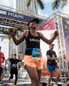 Runners cross the finish line of the Miami Half Marathon