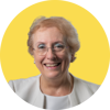 A circular image of Ros Eeles smiling on a yellow background