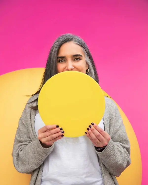 Curestarter Rita holding a yellow globe